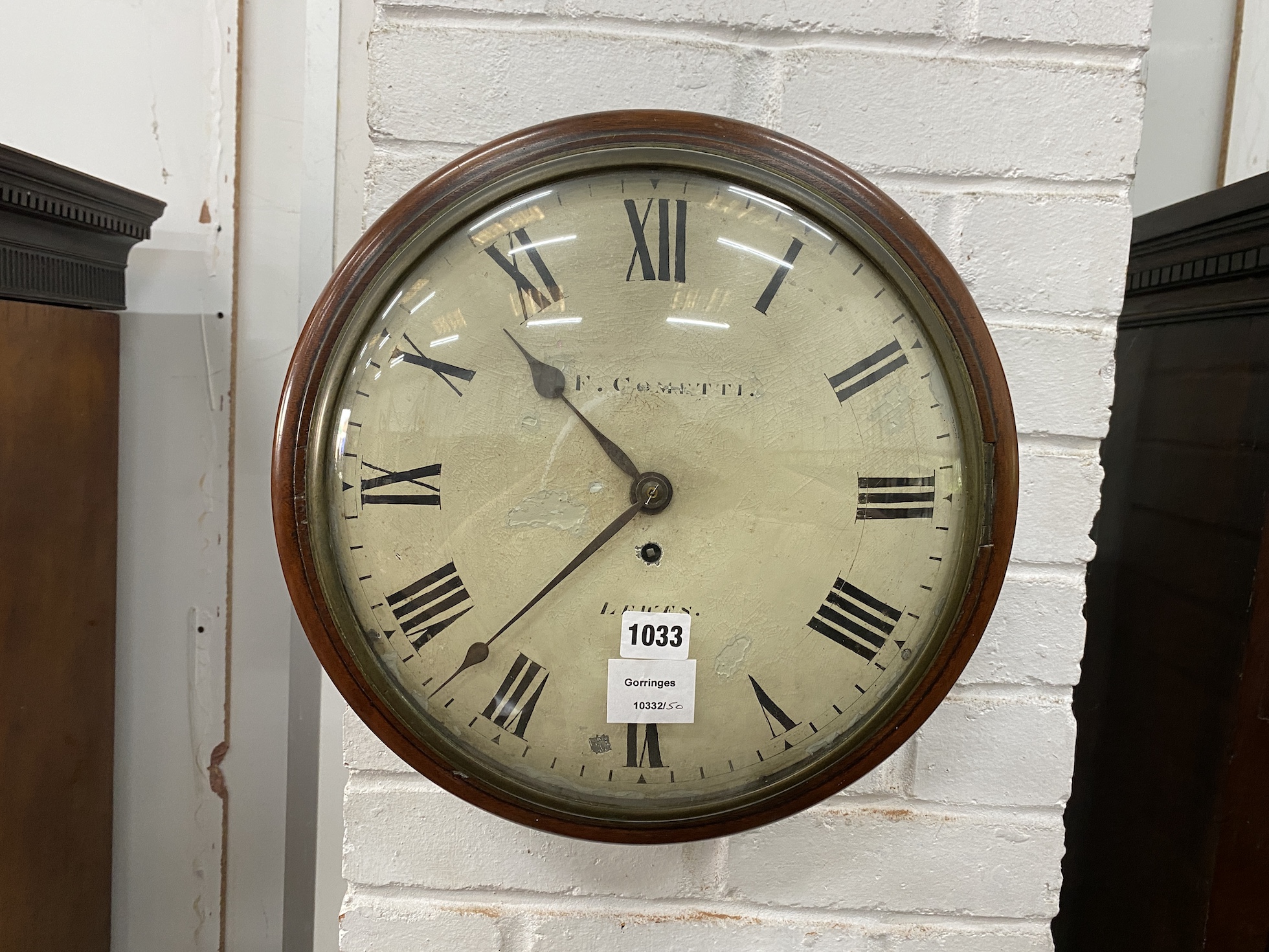 An early 19th century mahogany circular dialled eight day wall timepiece, the concave dial marked F. Cometti, Lewes, diameter 36cm